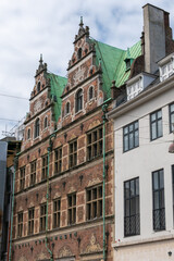 Obraz premium Various photos from the city center of Copenhagen the capital of Denmark harbor palace churches colorful buildings canals and general city view with cloudy weather and sunset colors