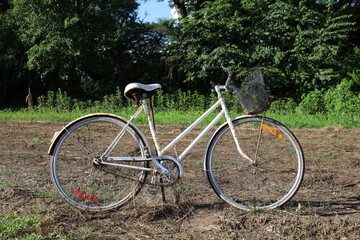 Old bicycle in the countryside, vintage bicycle in the field