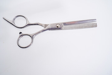 hair scissors isolated on white with advertising empty space.