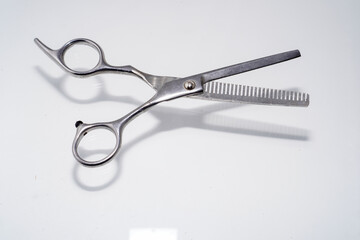 hair scissors isolated on white with advertising empty space.