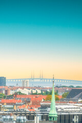 Various photos from the city center of Copenhagen the capital of Denmark harbor palace churches colorful buildings canals and general city view with cloudy weather and sunset colors