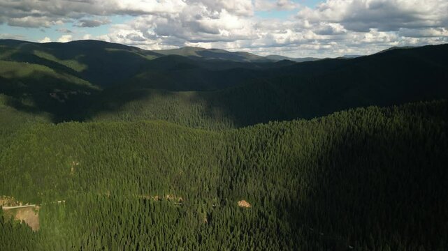 Aerial above Idaho mountains south of town of Wallace in st joe national forest at sunset