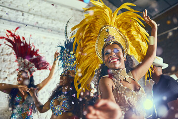 Carnival, performance and woman with samba for dance, parade and event in Brazil. Happiness, female dancer and celebration in city with creative fashion, confetti and music for tradition and culture