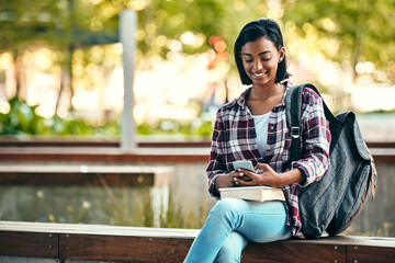 Girl, university student and phone with backpack, outdoor or education with smile for walking at campus. Indian person, happy and smartphone with books, texting and chat on social media at college