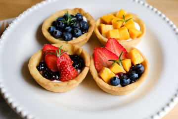 A delightful assortment of fruit tarts.ideal choice for culinary or food