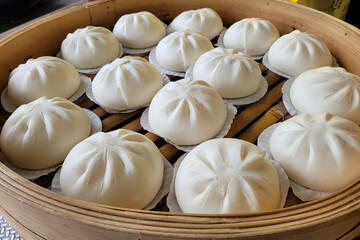 Dim Sum Buns in bamboo steamers, a classic Chinese cuisine.