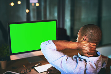 Businessman, night and neck pain with green screen on computer for stress, burnout or fatigue at office. Back view of man or employee working late with technology or mockup space for ache or injury