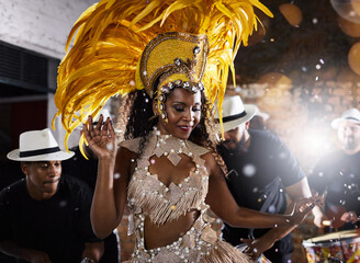 Woman, dancing and carnival for samba performance with music, parade and energy for celebration. Girl, happy and traditional fashion at night party with culture and crowd for event in rio de janeiro