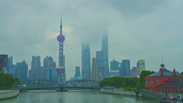 4K Timelapse - Uraban skyline and cityscape at sunrise on cloudy day in Shanghai China. footage of city skyline and modern buildings in Shanghai, China. Famous city landmarks in Shanghai China