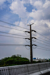 high voltage electricity tower background with sky clouds for copy space.