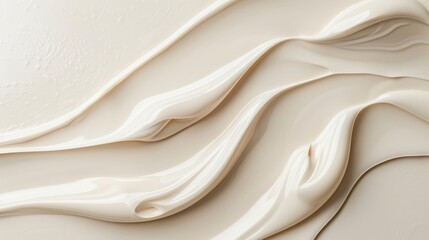 Fototapeta premium Smooth abstract creamy texture in beige shades, beautifully captured with light shadows, perfect for backgrounds and design concepts.