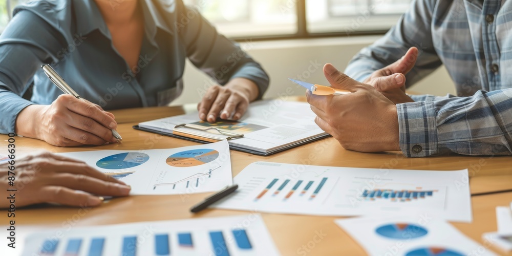 Poster a financial advisor meeting with clients, explaining investment options with charts and documents on