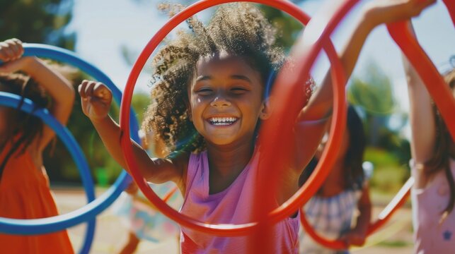 Joyful moment of children playing with hula hoops outdoors with friends.