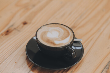Closeup of coffee cup on table in empty corporate conference room before business meeting in office