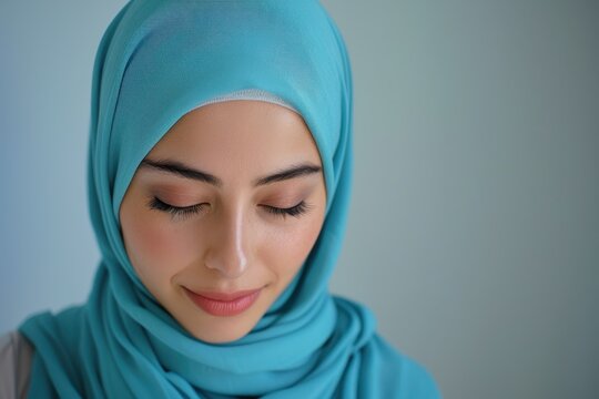 Portrait of a Young Woman in a Blue Hijab