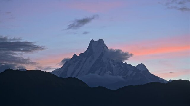 Sunset Mountain Top and Dramatic Sky in Nepal, Beautiful Sunset over Mountains Summit in Blue Hour at Poon Hill Viewpoint while Hiking and Trekking in Nepal, Big Snowcapped Mountain Peak