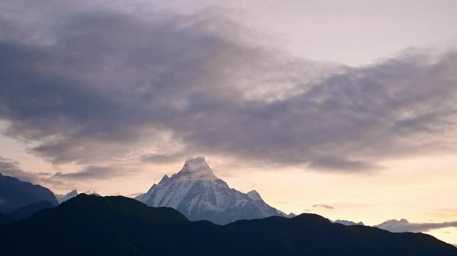 Sunset Sky and Clouds over Mountains in Nepal, Snowcapped Annapurna Mountains Landscape in Dramatic Himalayas Scenery with Fishtail Mountain Top at Poon Hill on Trek while Trekking and Hiking in Nepal