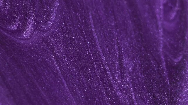 Glitter fluid spill. Paint bubbles. Blur purple blue color shimmering fizzy droplet texture oil ink polish wave abstract art background.