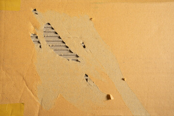 A worn damaged cardboard texture background