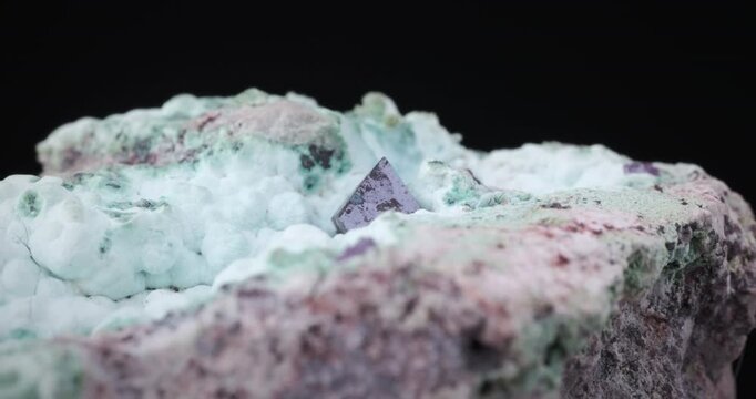 Cuprite on chrysocolla rotating footage. Specimen from Mashamba West Mine, Kolwezi, Lualaba, Dr Congo. detail texture background. close-up raw rough unpolished semi-precious gemstone 
