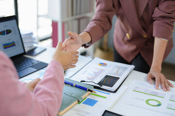 Two businesswoman shaking hands for success. Handshake. Collaboration, teamwork, friendship. Meeting of financial business partners, paperwork, calculations, investments, company partnerships.