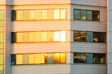 Sun reflection in modern glass tower. Paris suburb