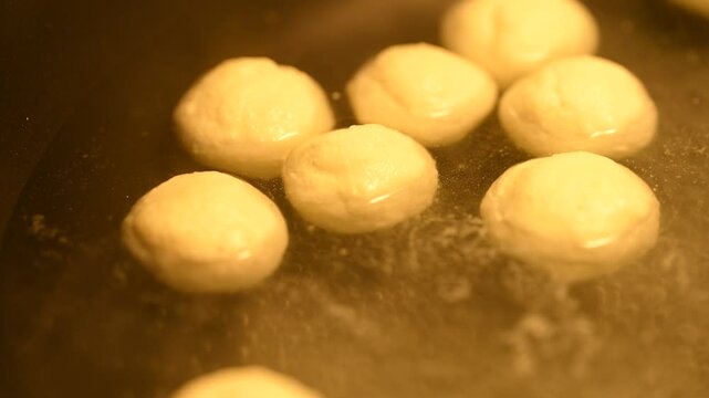 Famous Bengali or Indian sweets. Cheese ball dessert Rasgulla made with syrup in a bowl