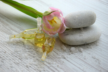 Spa concept. White spa stone and aroma oils with space for text. Meditation and minimalism. copyspase flatlay