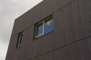 Modern architecture façade made of dark wood perspective view