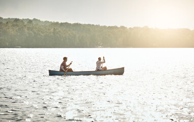 Boat, rowing and couple on lake for travel, vacation or weekend trip with summer adventure. Hobby,...