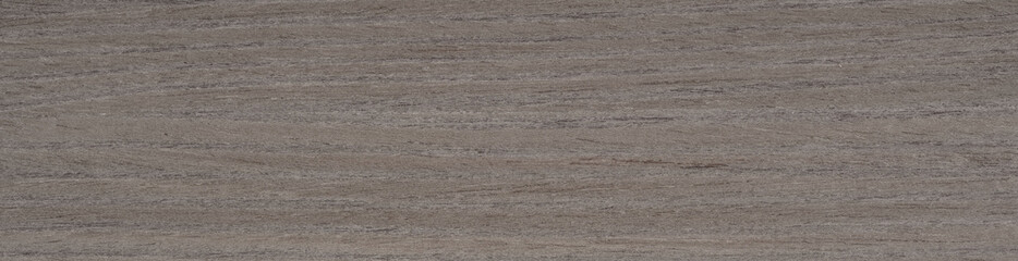 The understated grandeur of walnut veneer is presented in a symphony of espresso, charcoal, and soft purple undertones