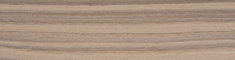 Flowing lines of natural Zebrano wood veneer blend shades of light oatmeal with dark coffee stripes, creating an organic rhythm