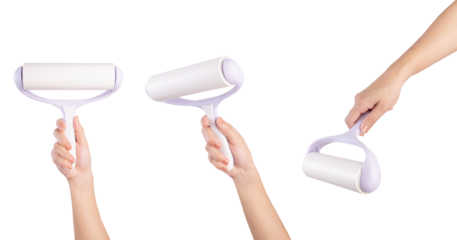 Female hand holding sticky hair removal roller isolated on white background.