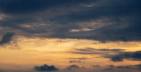 Sunset sky with orange clouds. Nature background.