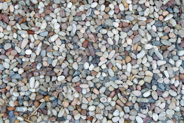 Stone pebbles texture or stone pebbles background. stone gravel for interior exterior decoration and industrial construction concept design. a naturally occurring stone pebble motif.