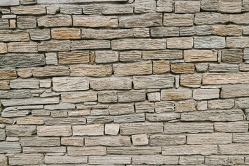 The texture of a wall made of hewn stones.