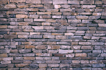 Tinted texture of a stone wall.