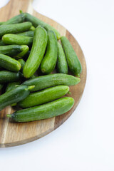 Mini cucumbers on white background.