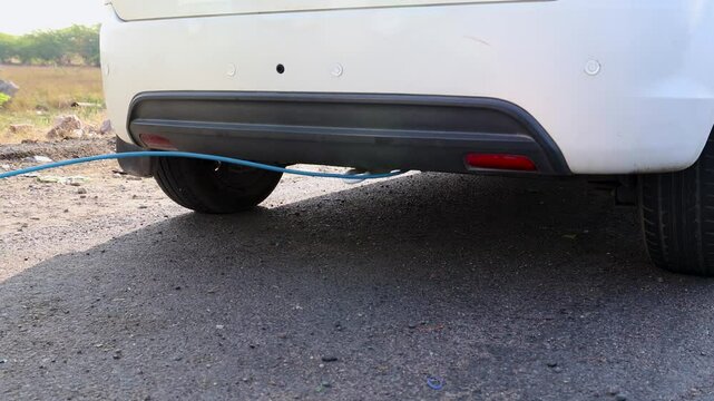 pollution checking of car under progress at national highway at day