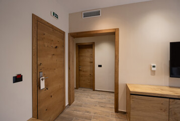 Interior of a carpeted hotel corridor doorway