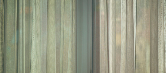 Bright light coming from the living room window through white curtains