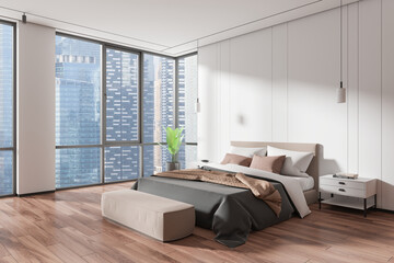 Cozy home bedroom interior with bed and nightstand, panoramic window