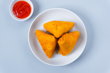 Risol or rissoles. served with chili sauce or chili. perfect for recipe, article, catalogue, promotion, or any cooking contents. with copy space.