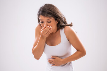 Fototapeta premium Portrait of adult woman who is having nausea.