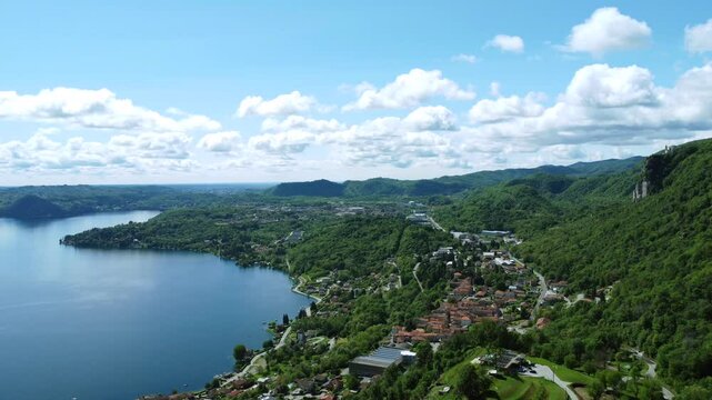 Pella village on lake Orta in Northern Italy. Aerial forward and sky for copy space