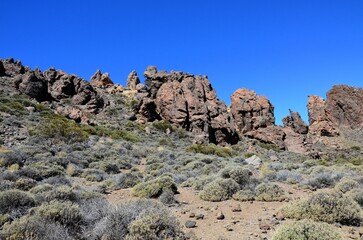 Scenic view of volcanic rock formations in desert during sunny day, Teide National Park, Tenerife