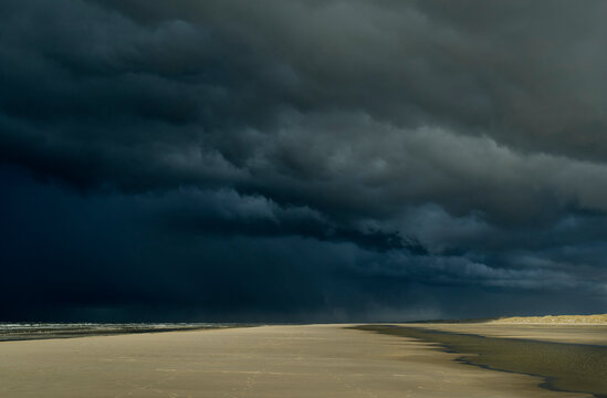 Heavy storm clouds moving towards beach