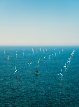 Wind turbines in north sea under sky