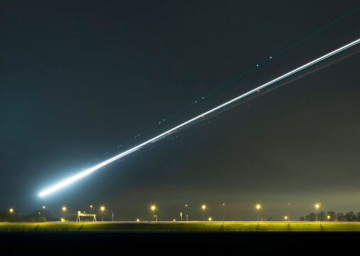 Airplane light trail landing at Amsterdam Schiphol Airport