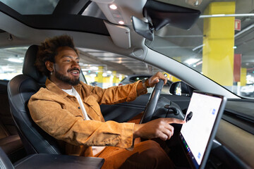 Man using touch screen navigation in car